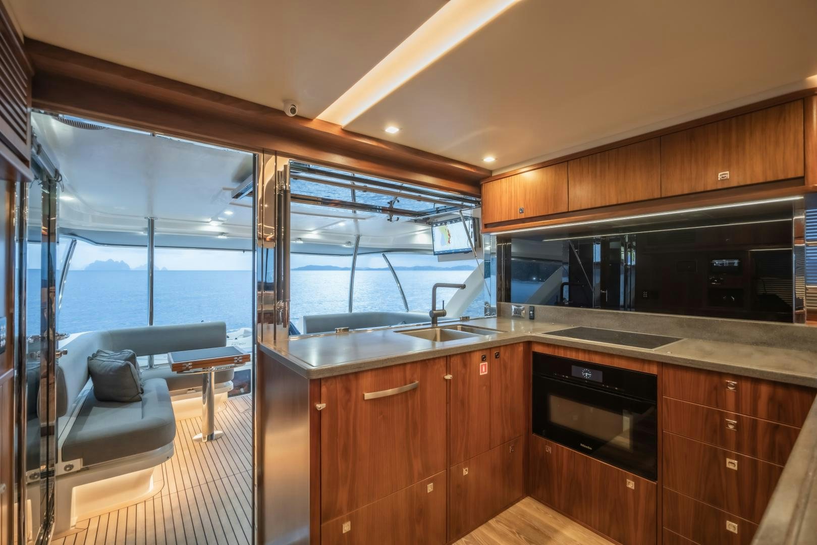 a kitchen with a large window aboard FAT BOY Yacht for Sale