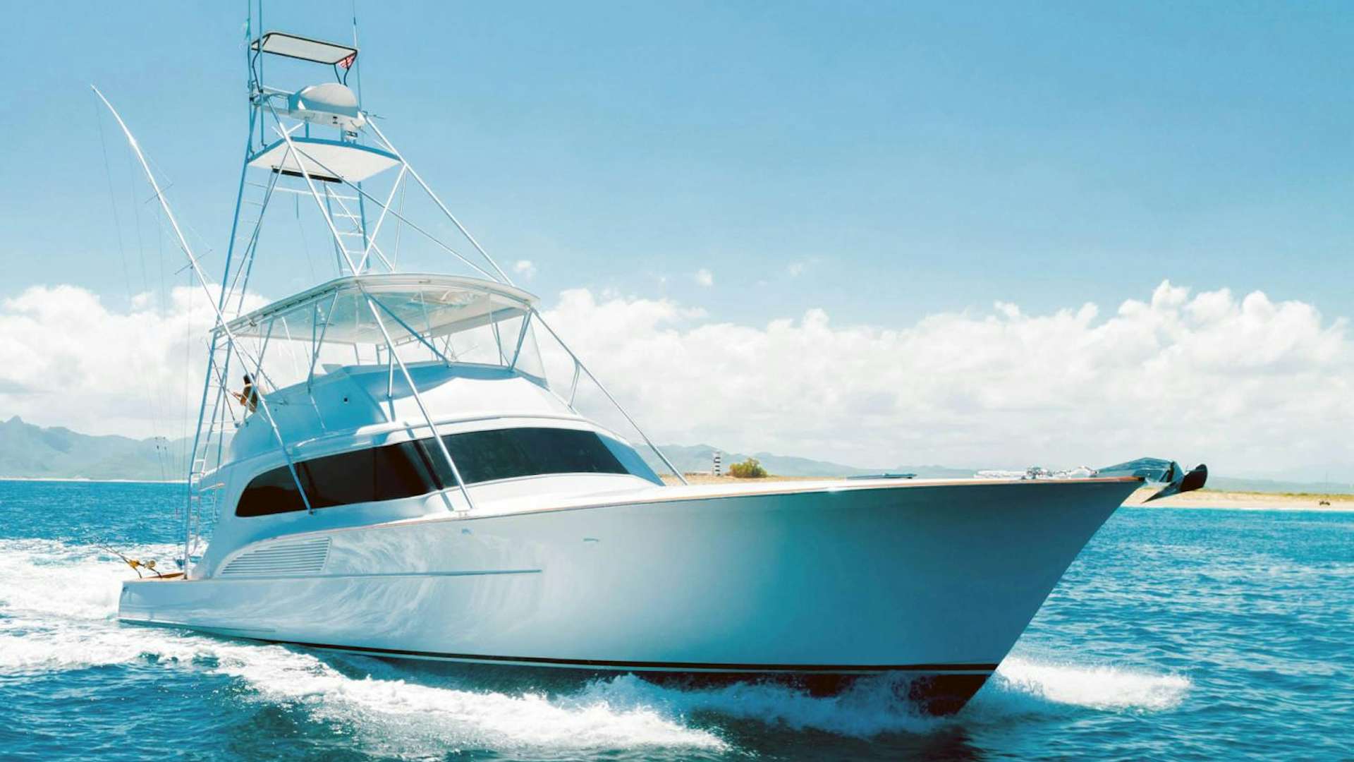 a white boat on the water aboard KAHUNA Yacht for Sale