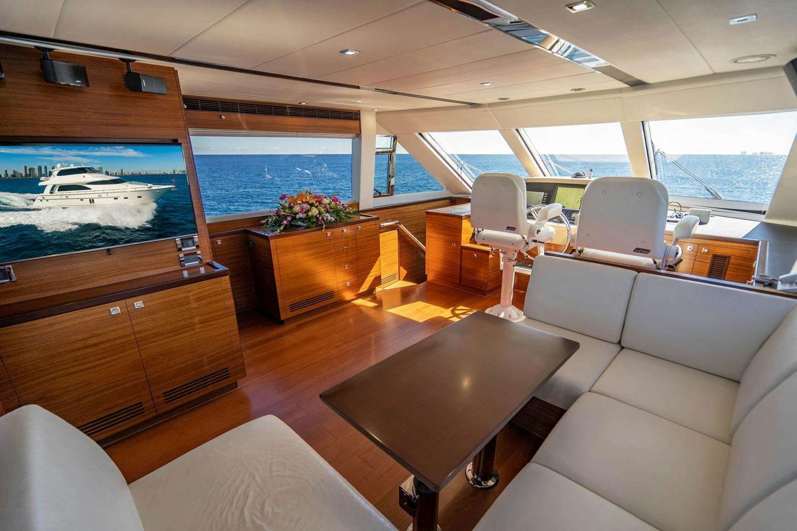 inside of a vehicle with a large screen and a large window aboard LIFE Yacht for Sale