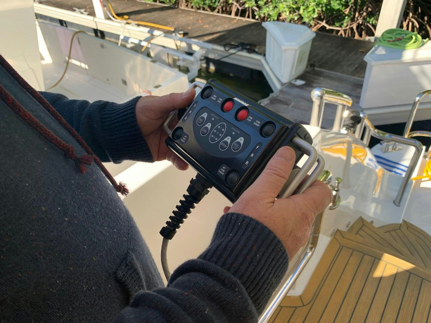 a person holding a video game controller aboard LIFE Yacht for Sale