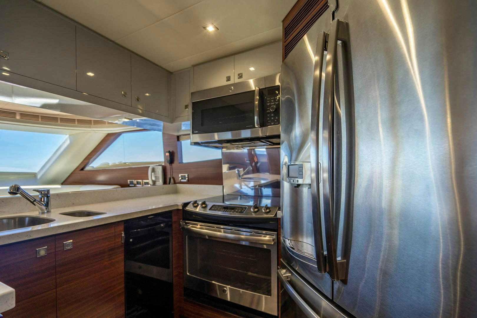 a kitchen with stainless steel appliances aboard LIFE Yacht for Sale