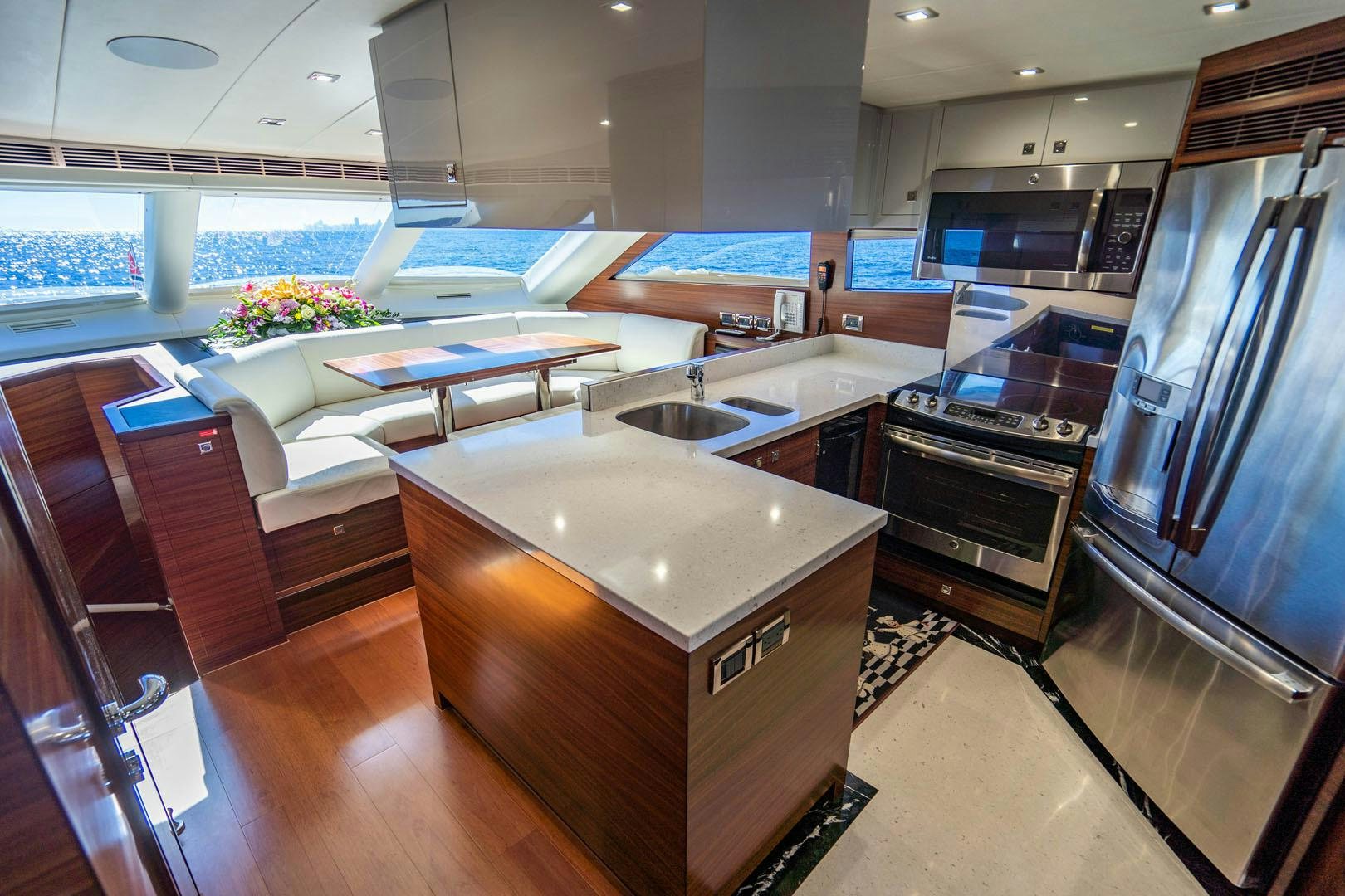 a kitchen with a large island aboard LIFE Yacht for Sale