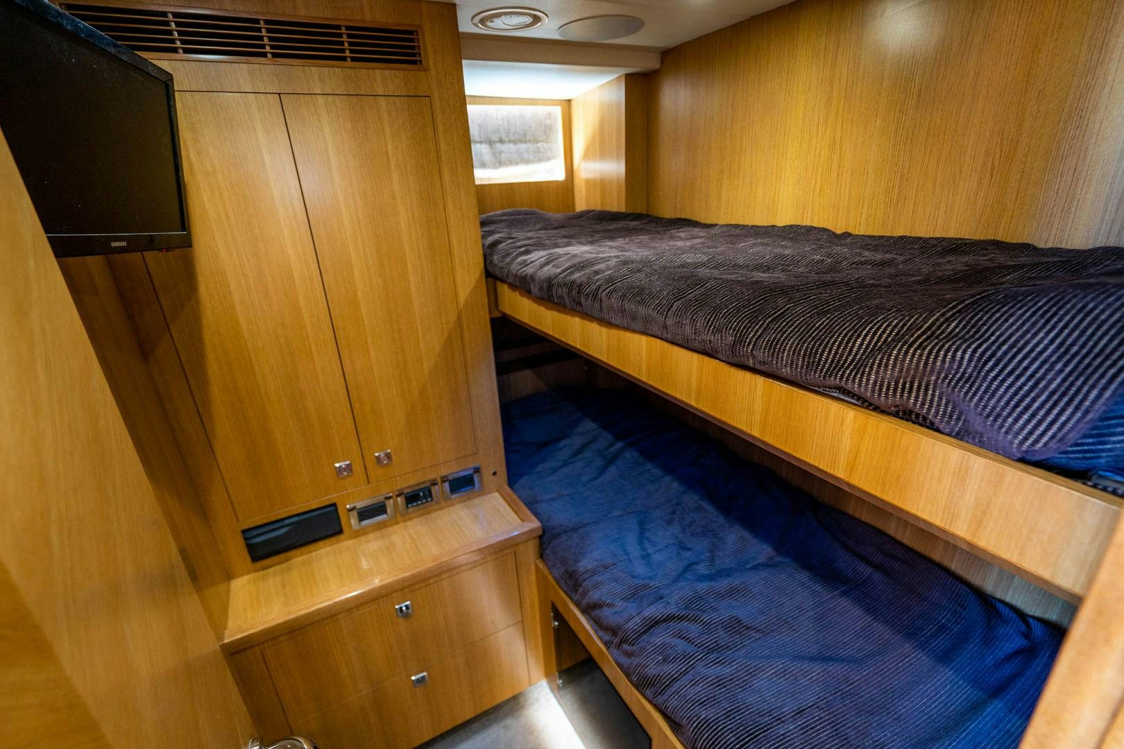 a bed in a room aboard LIFE Yacht for Sale