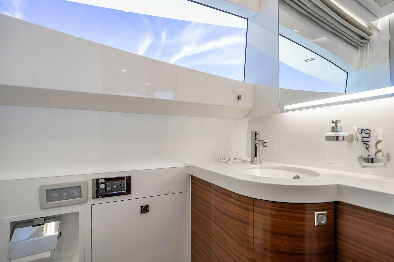 a kitchen with a sink and a microwave aboard LIFE Yacht for Sale