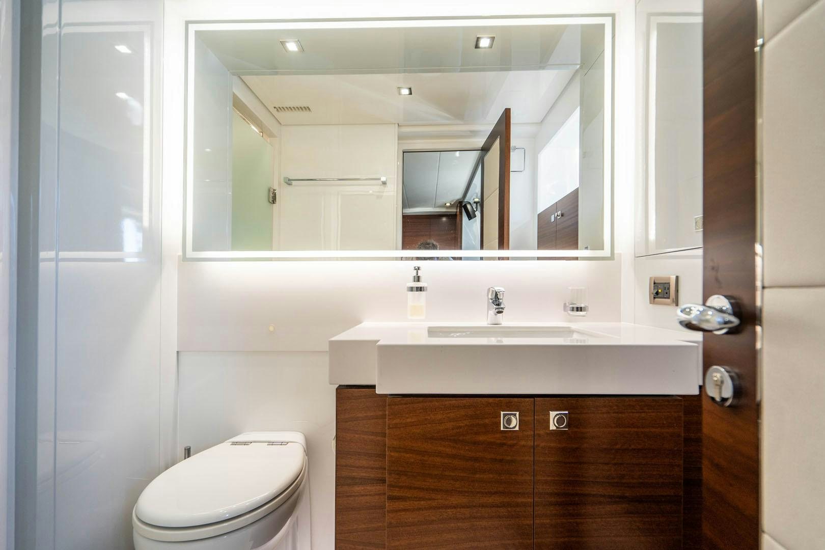 a bathroom with a large mirror aboard LIFE Yacht for Sale