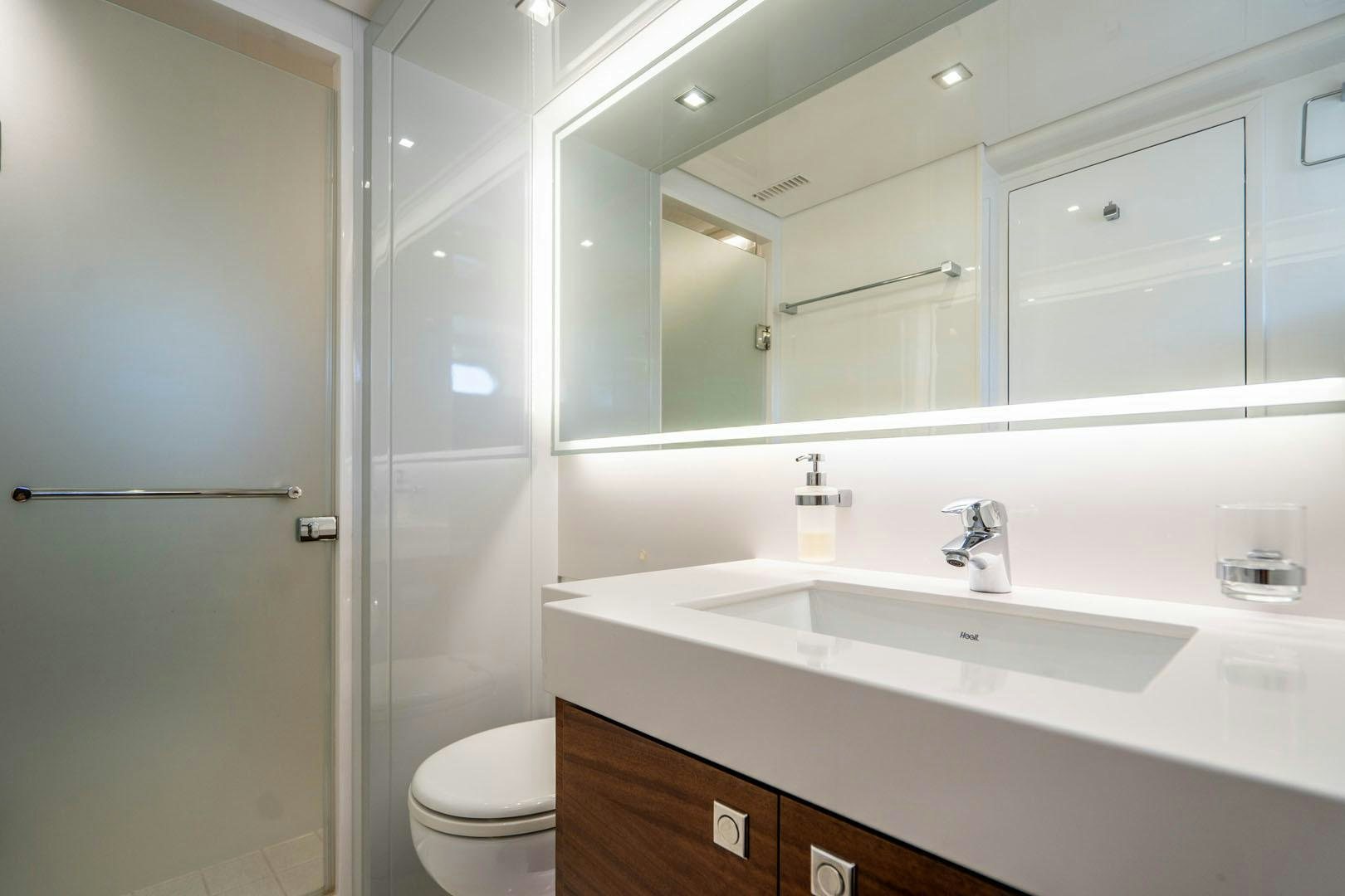 a bathroom with a glass shower aboard LIFE Yacht for Sale