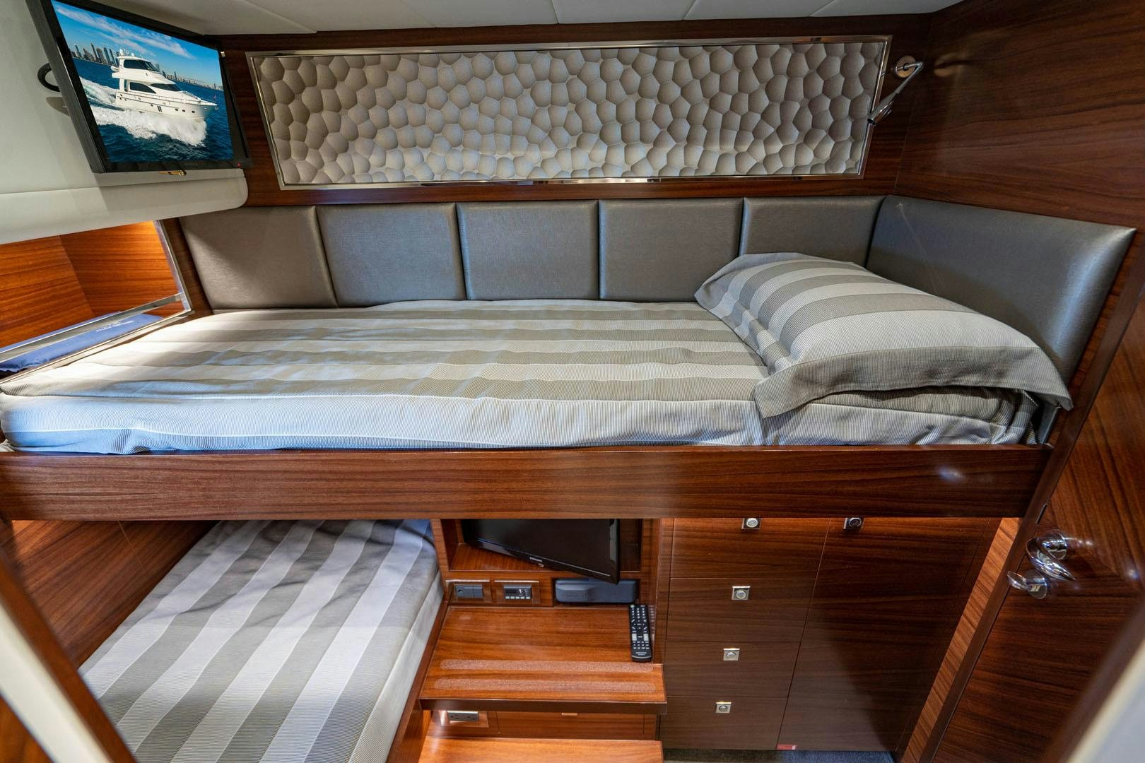 a bed with a white sheet aboard LIFE Yacht for Sale