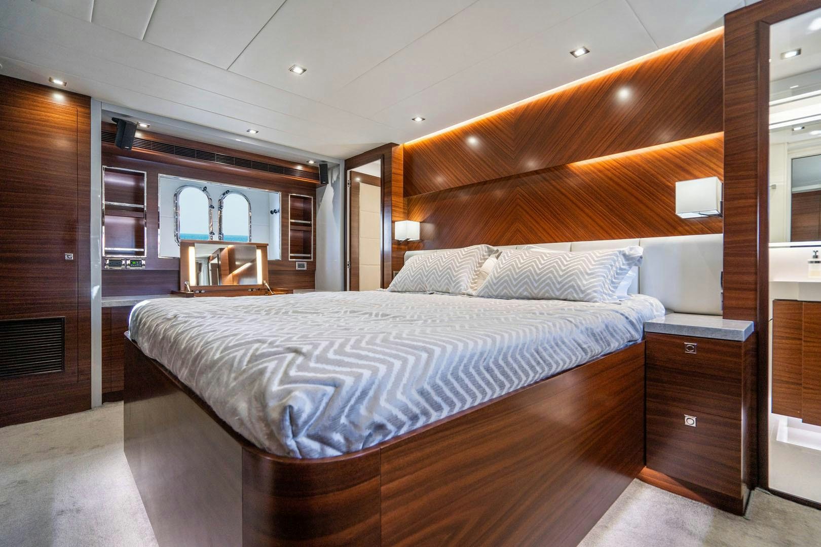 a large bed in a room aboard LIFE Yacht for Sale