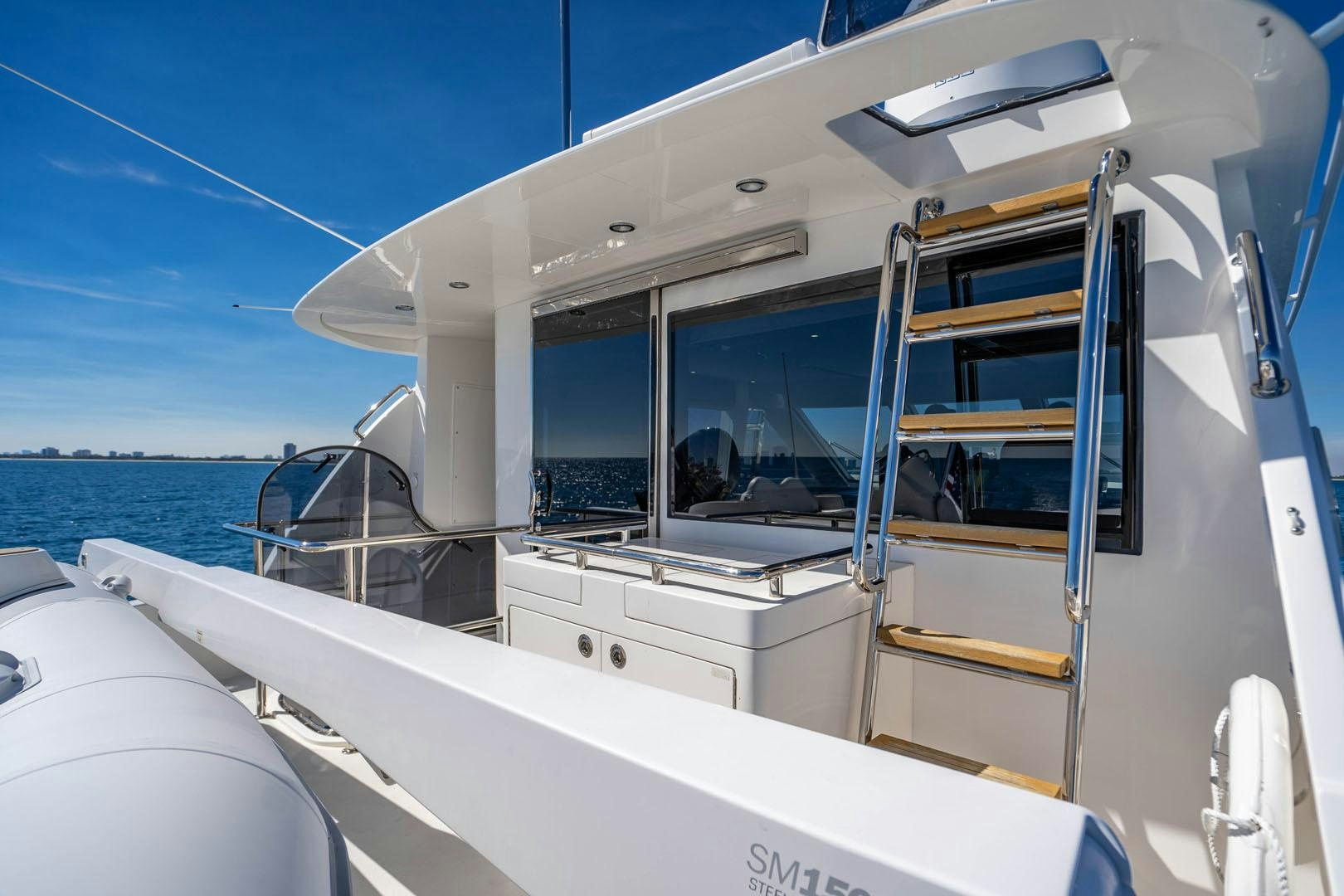 a boat with a ladder aboard LIFE Yacht for Sale