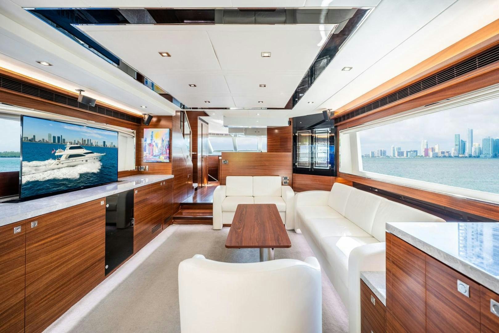 inside of a building with a large screen and a large window aboard LIFE Yacht for Sale