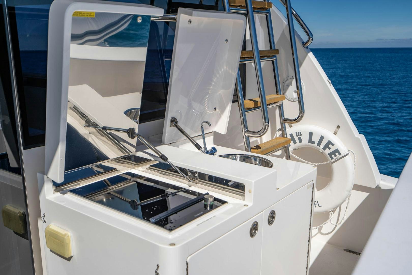 a white boat on the water aboard LIFE Yacht for Sale