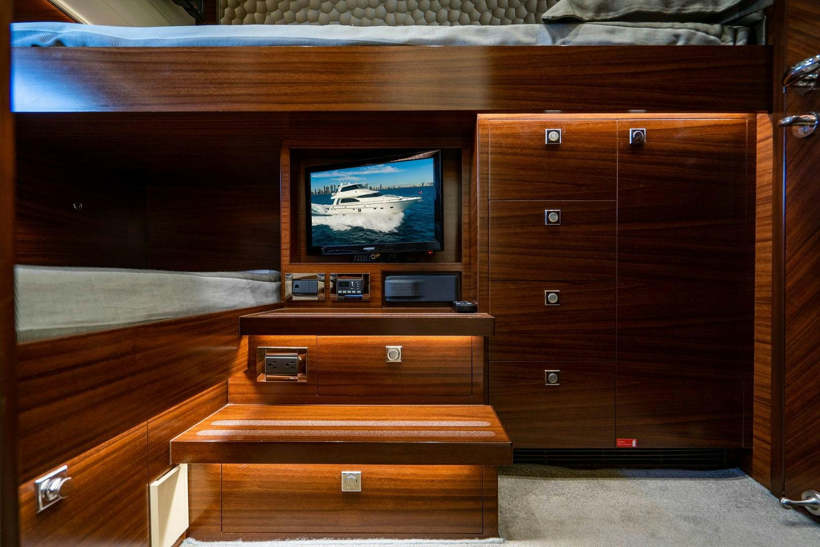 a tv on a dresser aboard LIFE Yacht for Sale