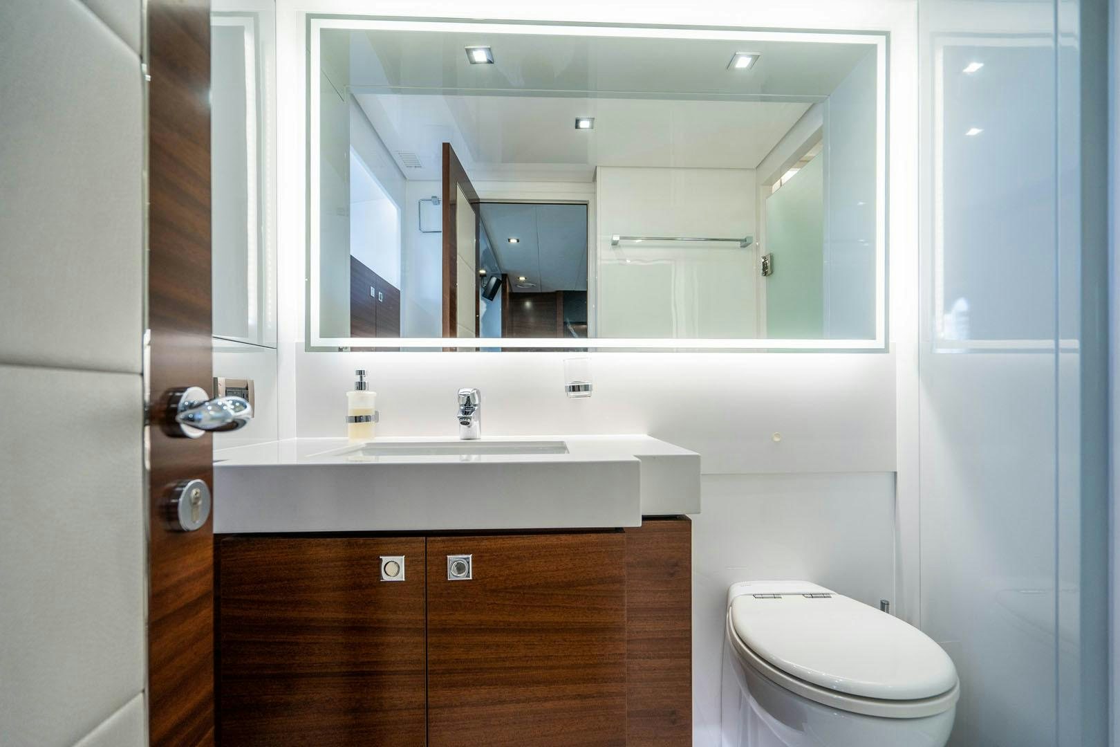 a bathroom with a large mirror aboard LIFE Yacht for Sale