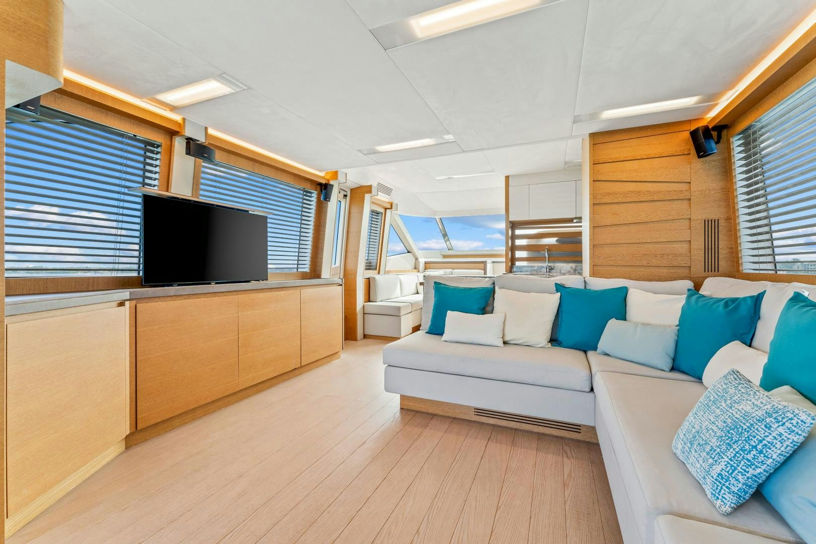 a room with a couch and a television aboard MONTE CARLO Yacht for Sale