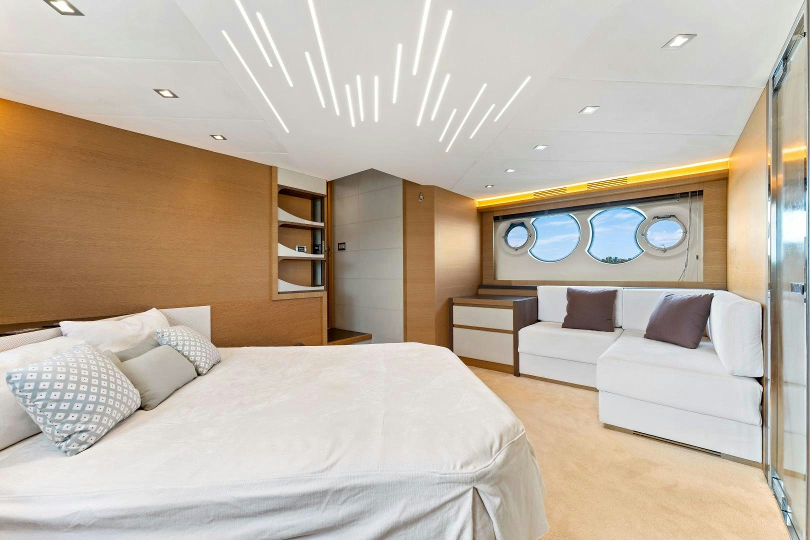 a room with a bed and a couch aboard MONTE CARLO Yacht for Sale