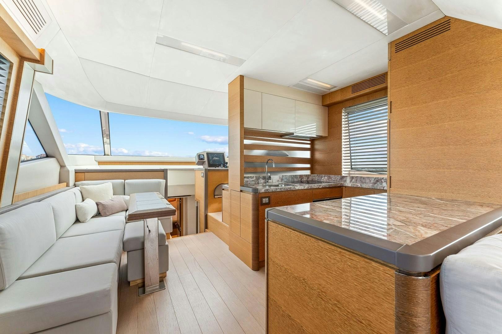 a room with a couch and a table aboard MONTE CARLO Yacht for Sale