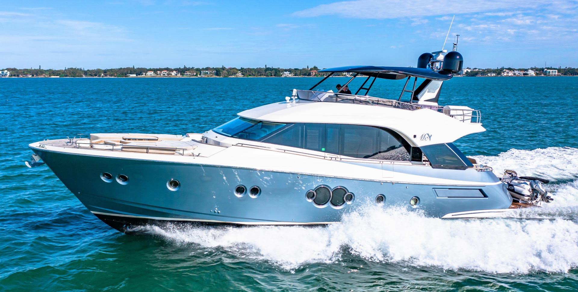 a white boat in the water aboard MONTE CARLO Yacht for Sale