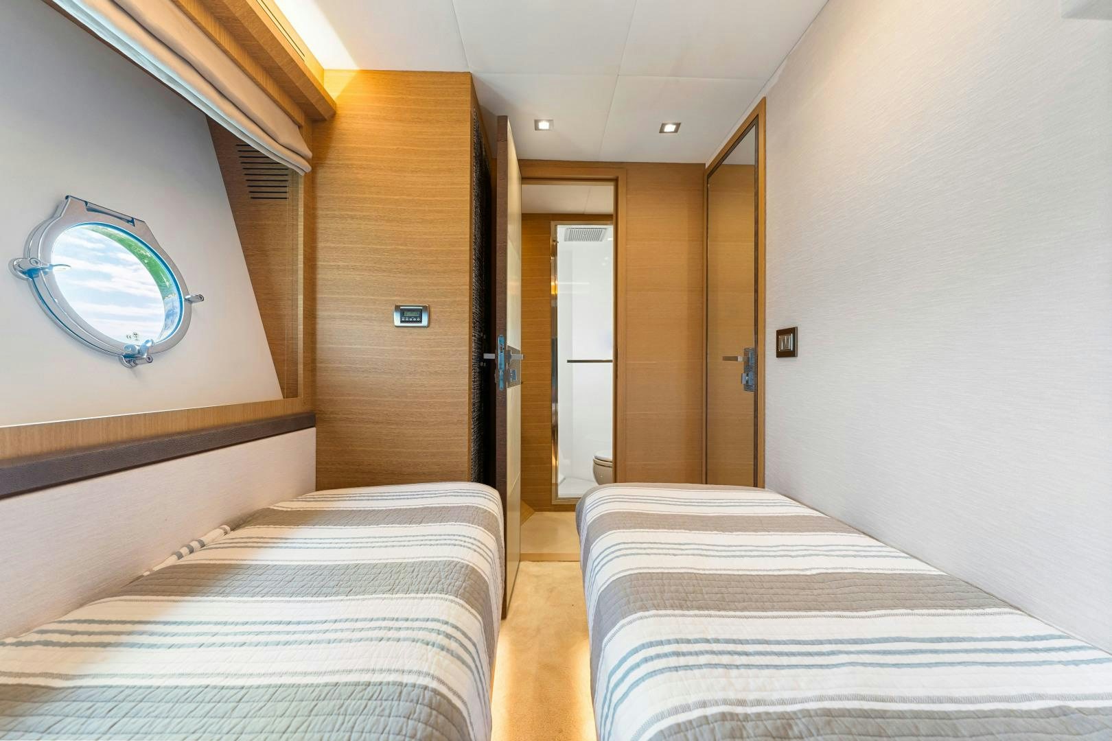 a room with a bed and a mirror aboard MONTE CARLO Yacht for Sale