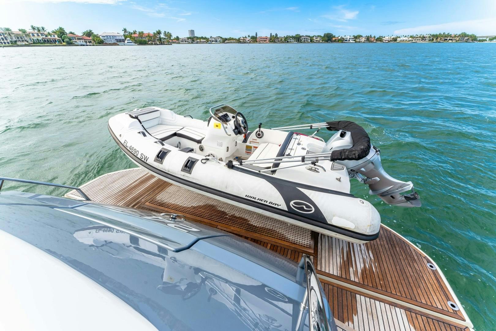 a boat with a motor attached to it aboard MONTE CARLO Yacht for Sale