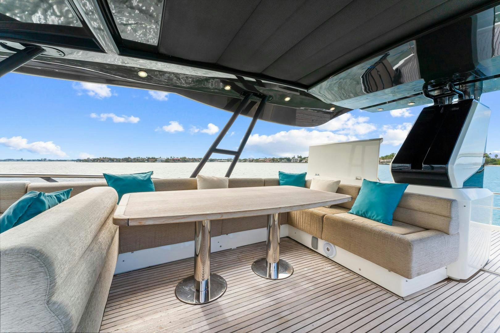a boat with a table and a tv on the deck aboard MONTE CARLO Yacht for Sale