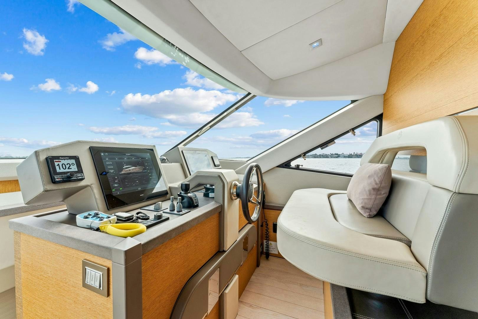 a plane cockpit with a desk and a computer on it aboard MONTE CARLO Yacht for Sale