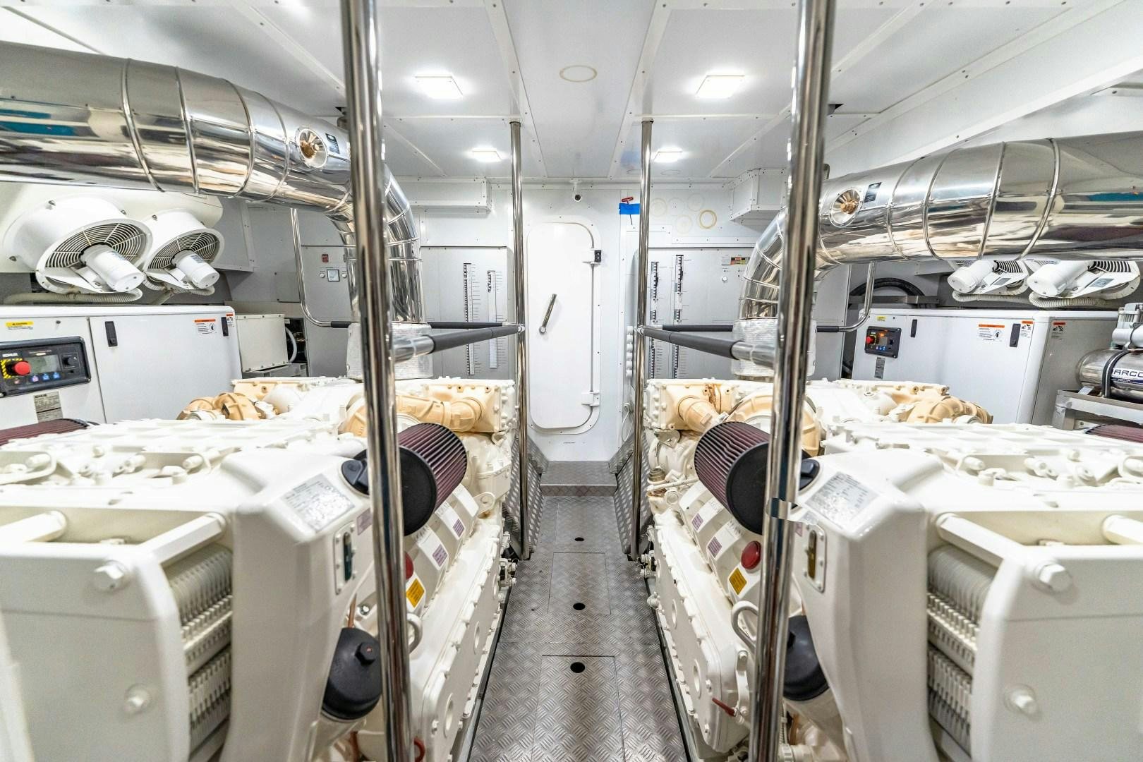a room with white shelves and white walls and a black chair aboard MONTE CARLO Yacht for Sale