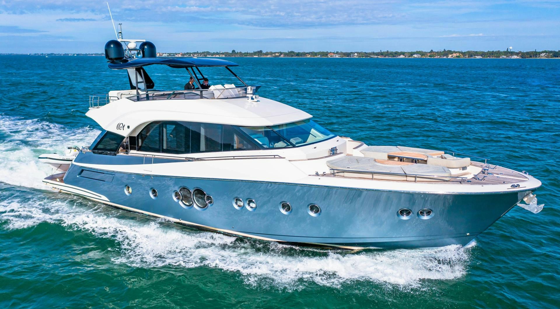 a white boat on the water aboard MONTE CARLO Yacht for Sale