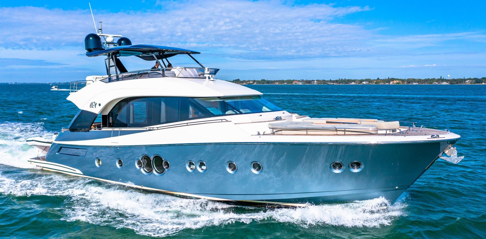 a white boat on the water aboard MONTE CARLO Yacht for Sale