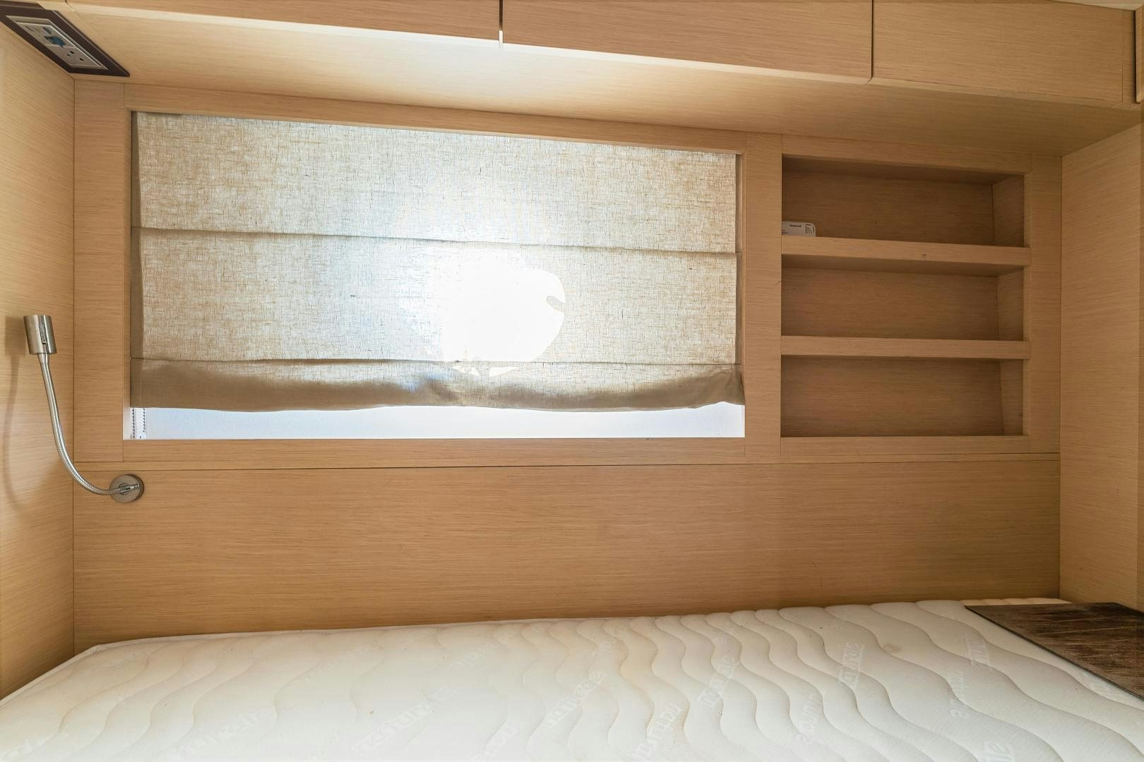 a wooden shelf with a white sheet aboard MONTE CARLO Yacht for Sale