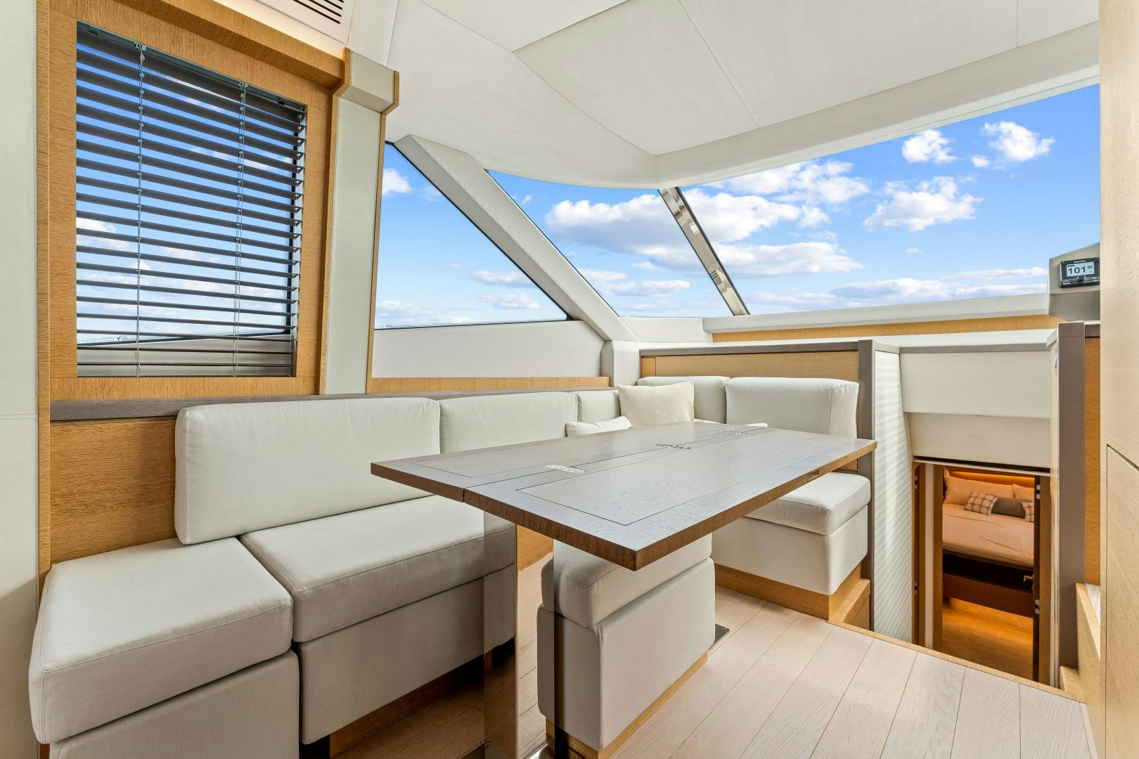 a room with a table and chairs aboard MONTE CARLO Yacht for Sale