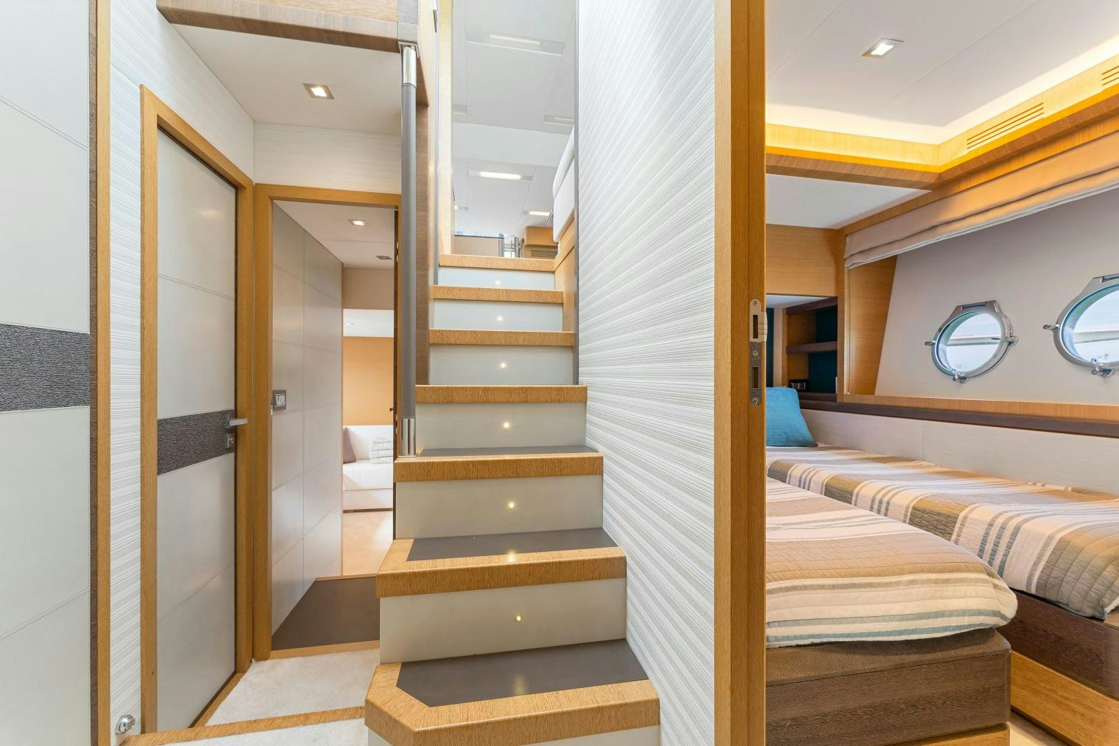 a room with a bed and a door aboard MONTE CARLO Yacht for Sale