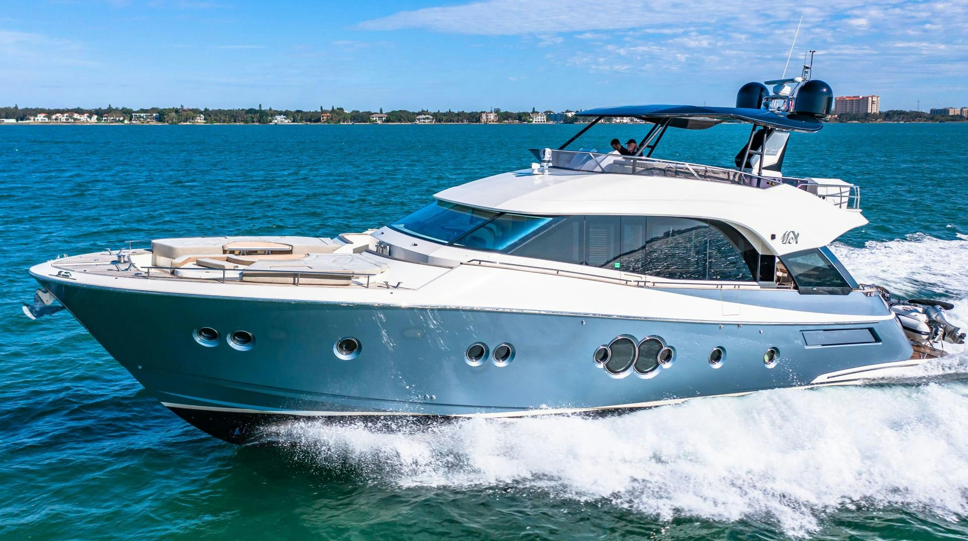 a white boat on the water aboard MONTE CARLO Yacht for Sale