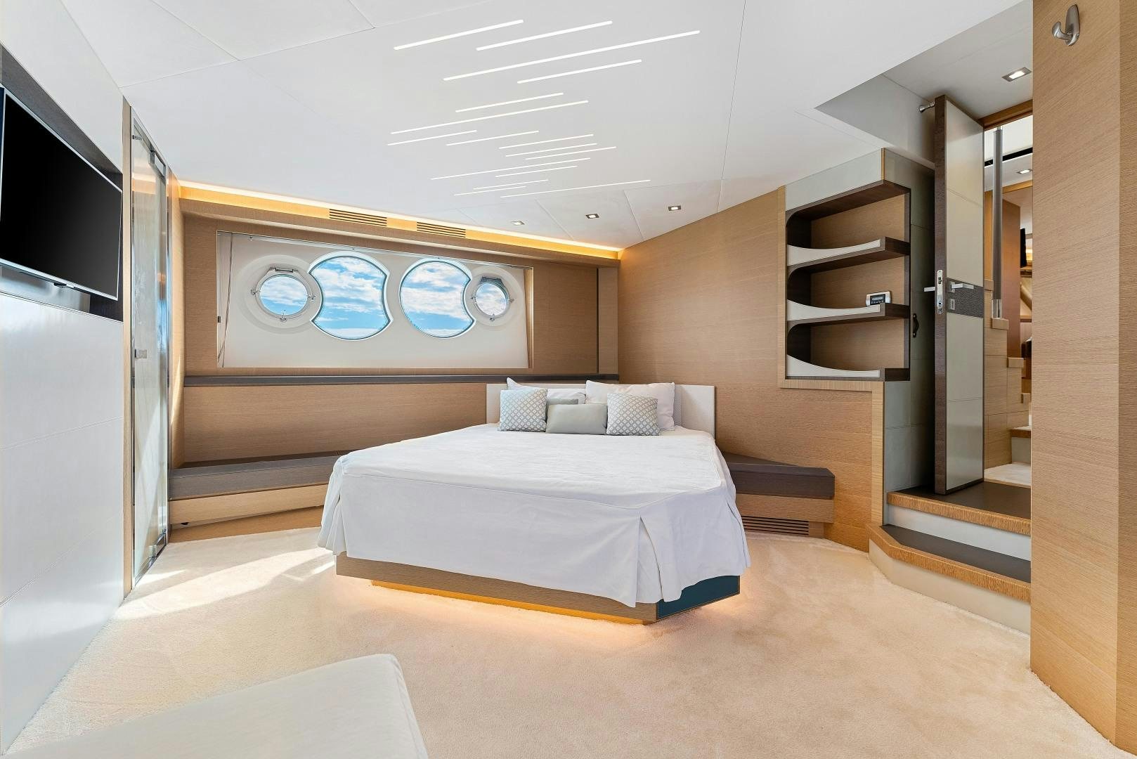 a room with a bed and a bookcase aboard MONTE CARLO Yacht for Sale