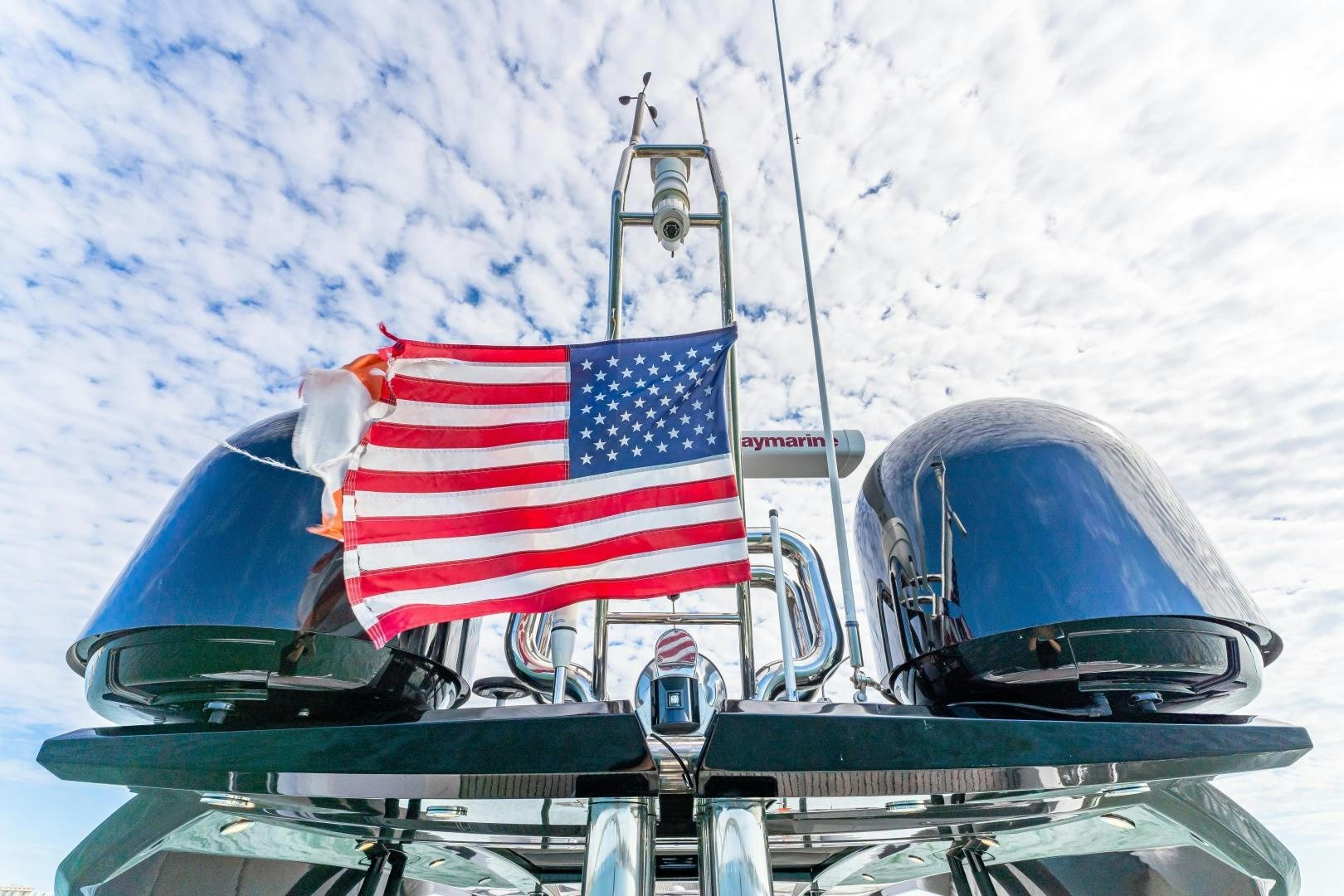a boat with a flag on it aboard MONTE CARLO Yacht for Sale
