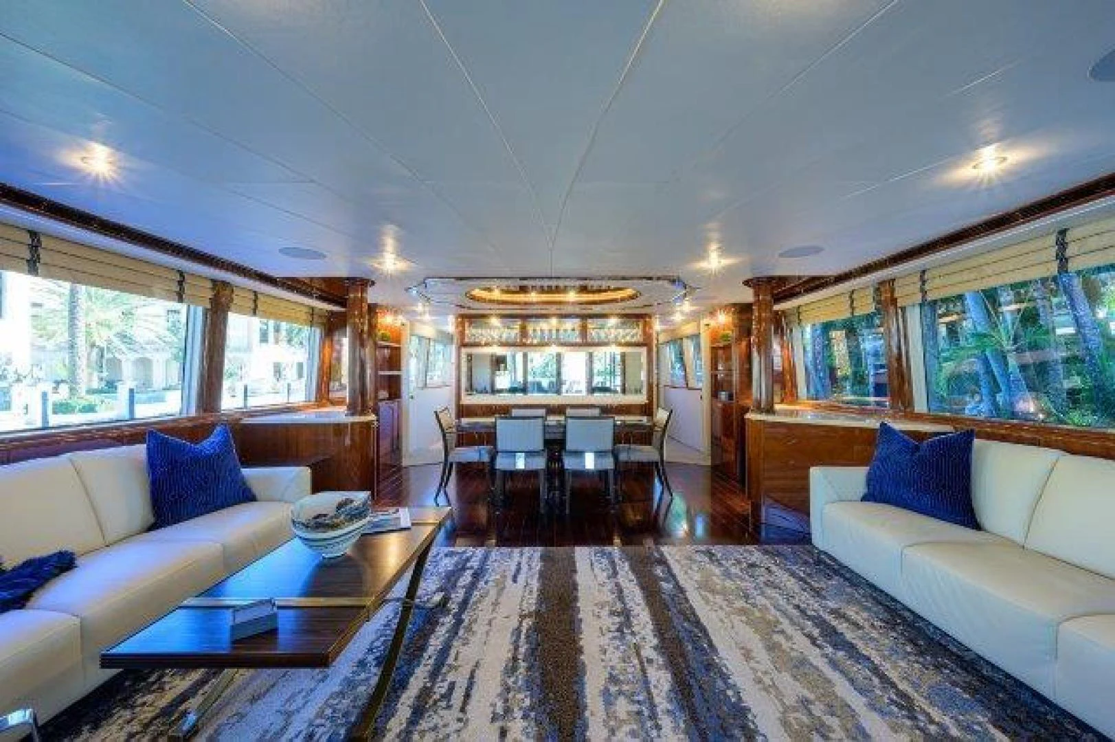 a living room with a large rug aboard TRYST Yacht for Sale