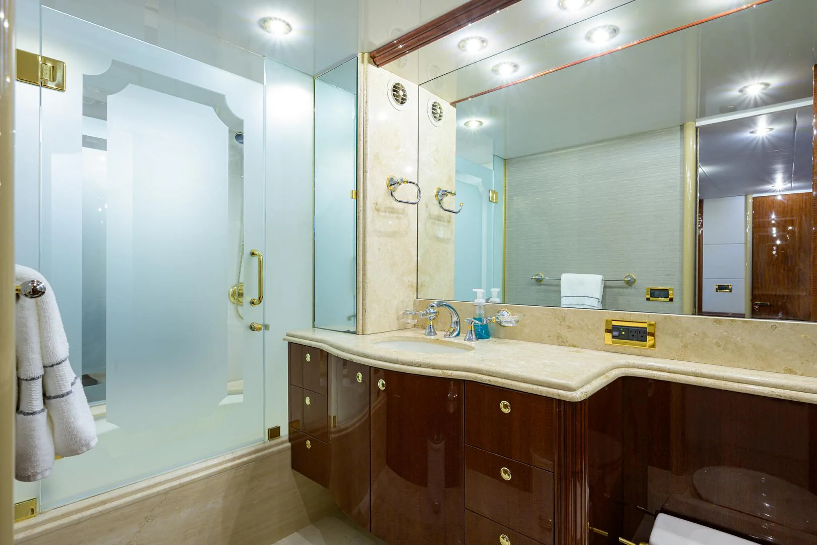 a bathroom with a large mirror aboard TRYST Yacht for Sale