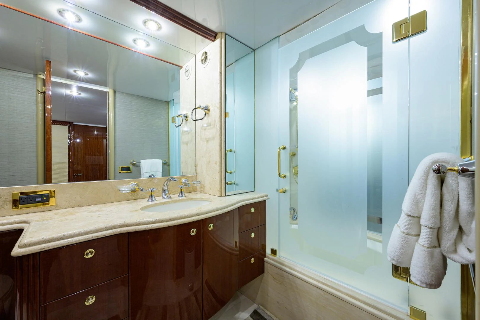 a bathroom with a large mirror aboard TRYST Yacht for Sale