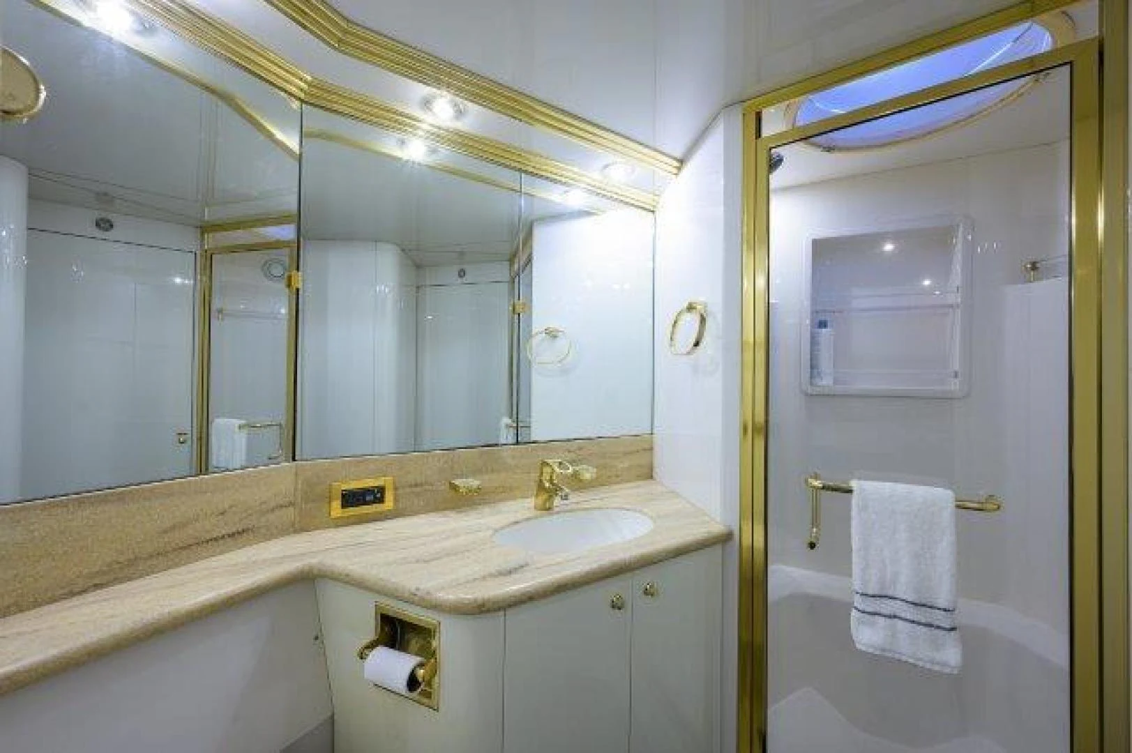 a bathroom with a large mirror aboard TRYST Yacht for Sale