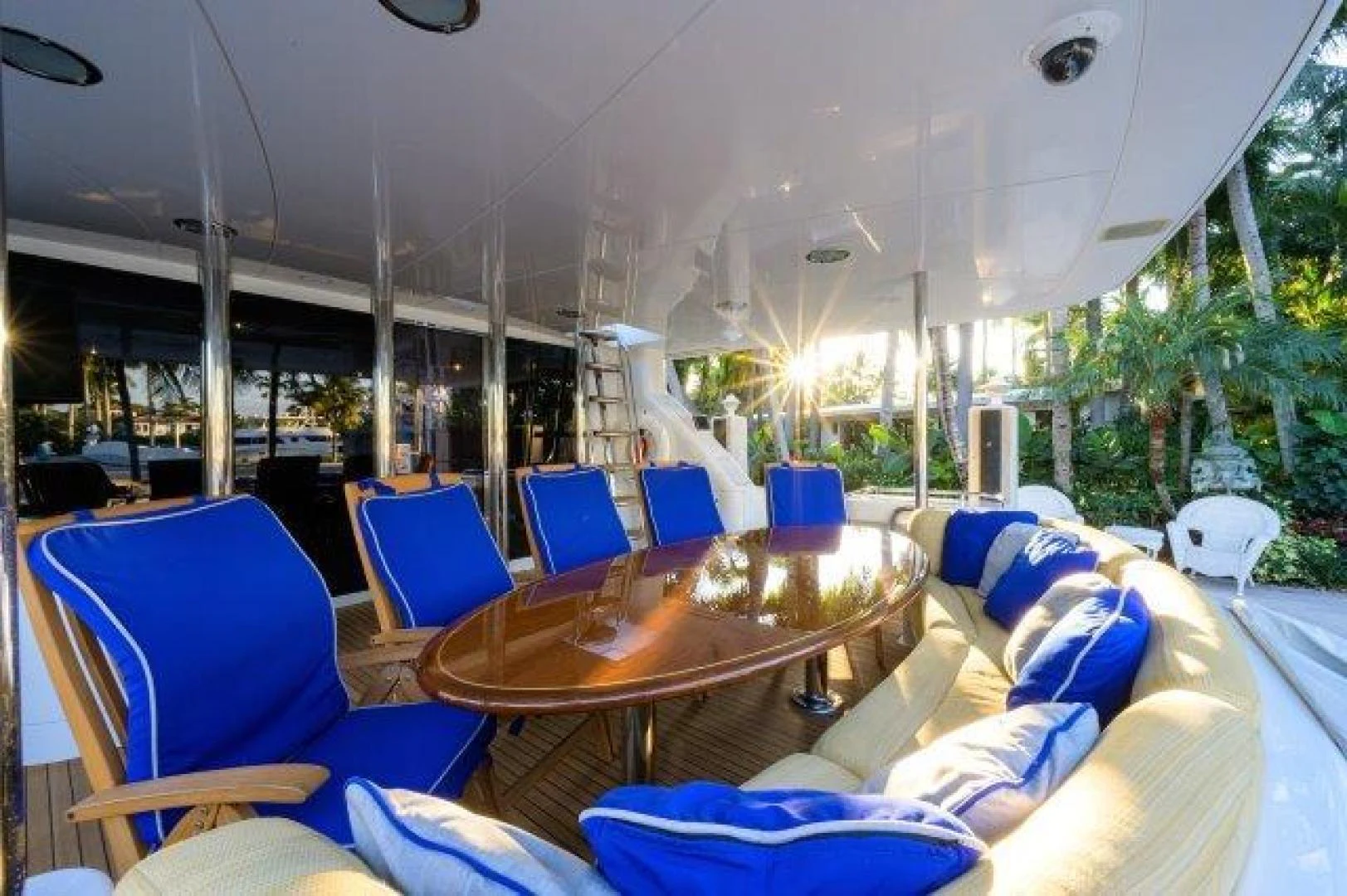 a boat with a table and chairs aboard TRYST Yacht for Sale