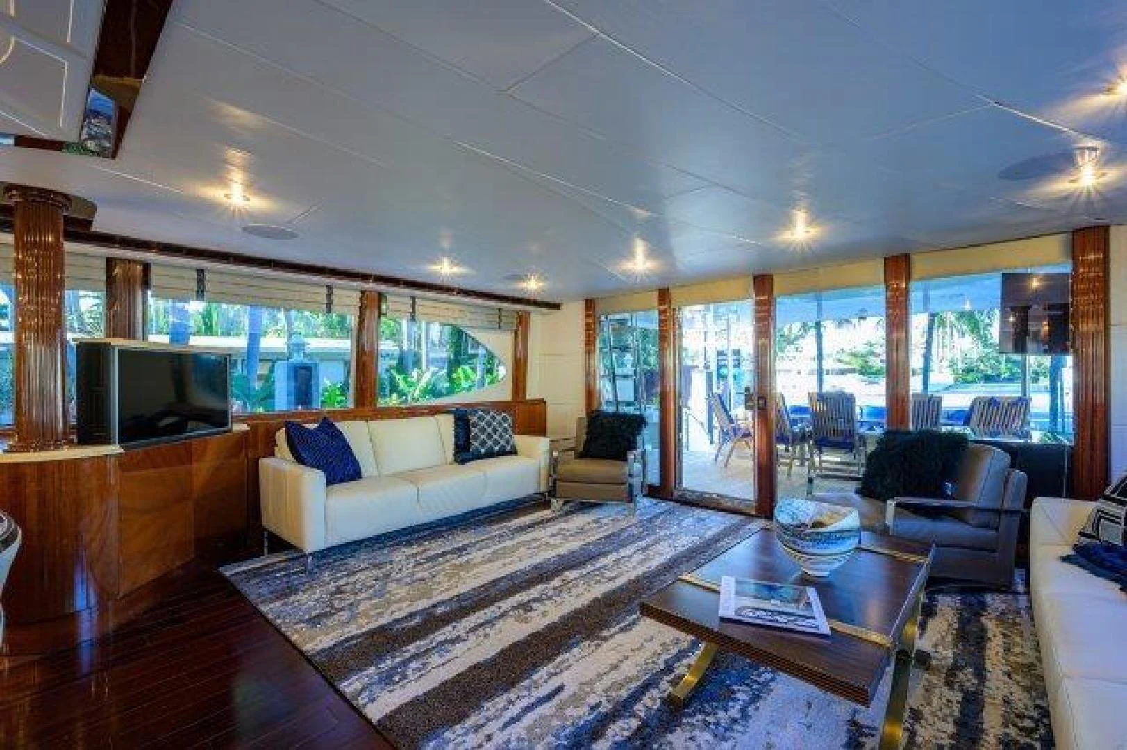 a living room with a large window aboard TRYST Yacht for Sale