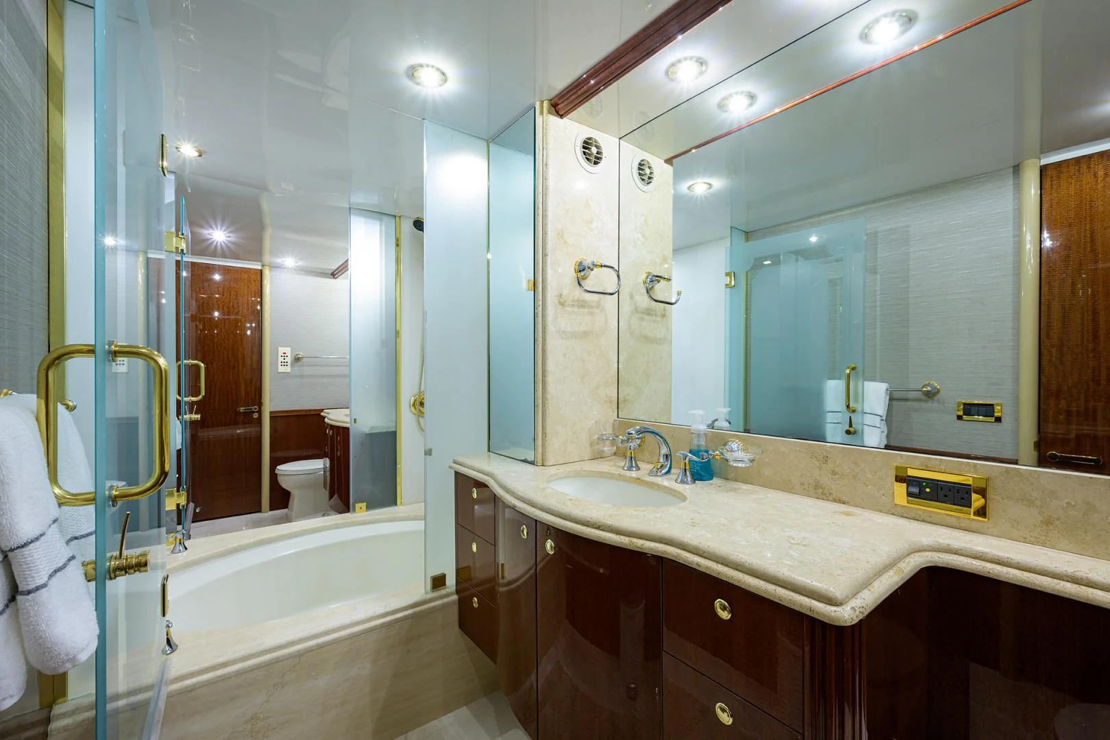 a bathroom with a large mirror aboard TRYST Yacht for Sale