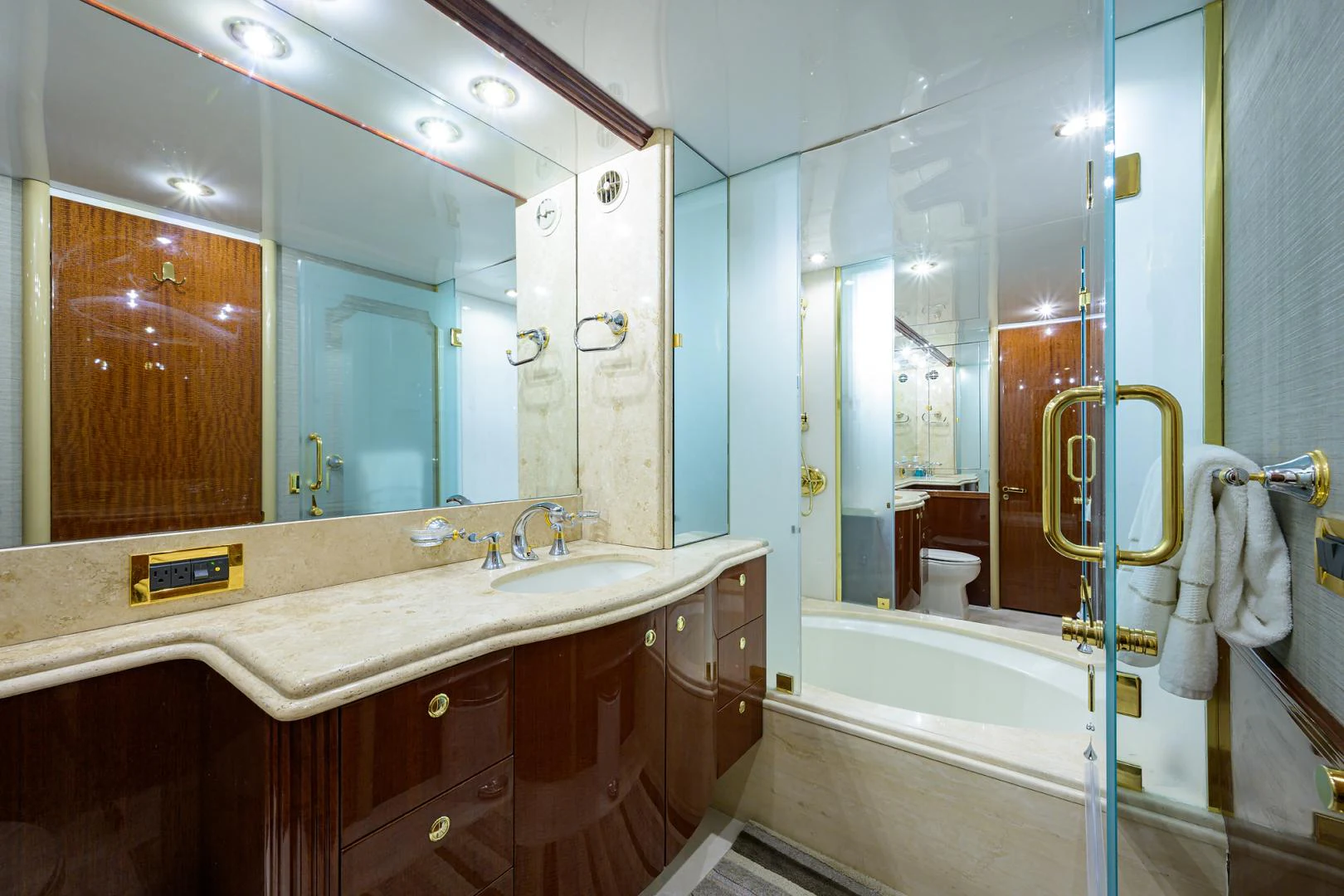 a bathroom with a large mirror aboard TRYST Yacht for Sale