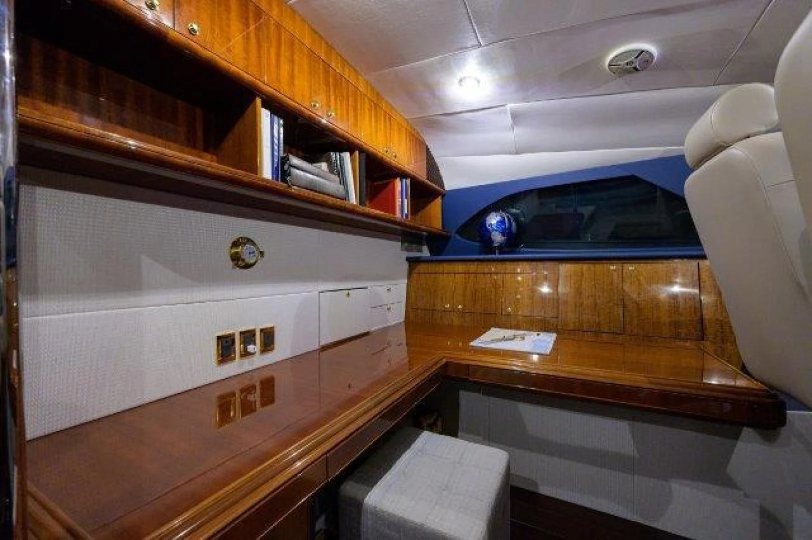 a room with a desk and a chair aboard TRYST Yacht for Sale