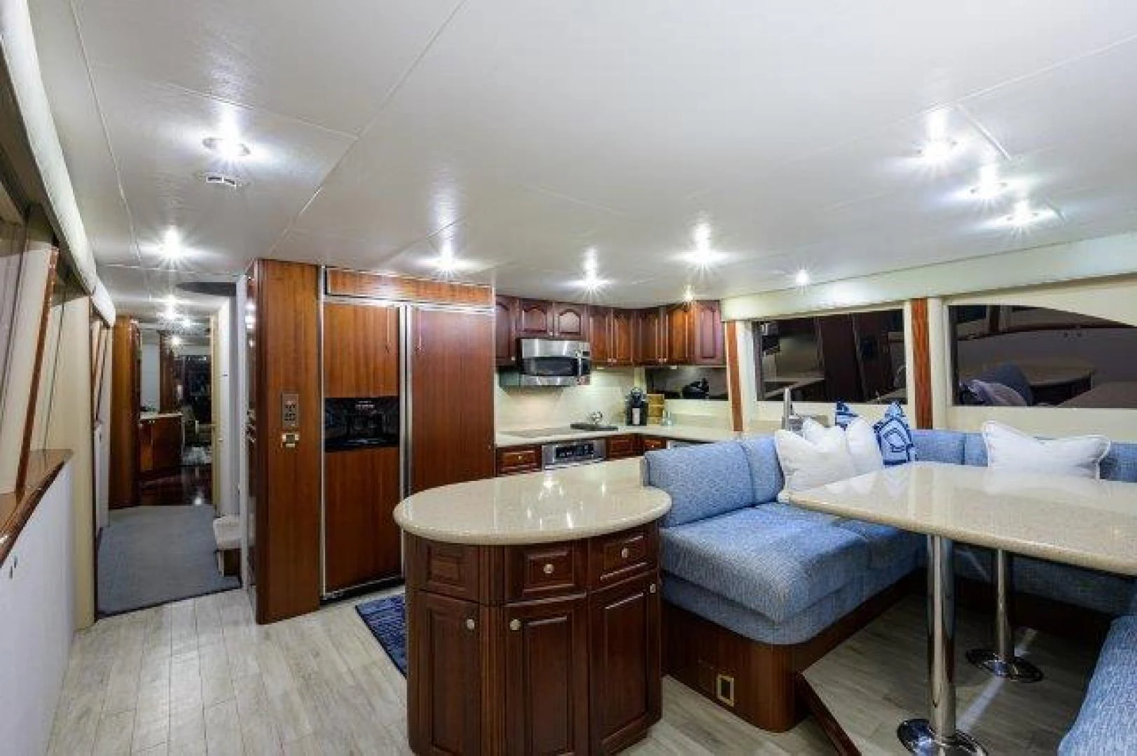 a bedroom with a bed and a couch aboard TRYST Yacht for Sale