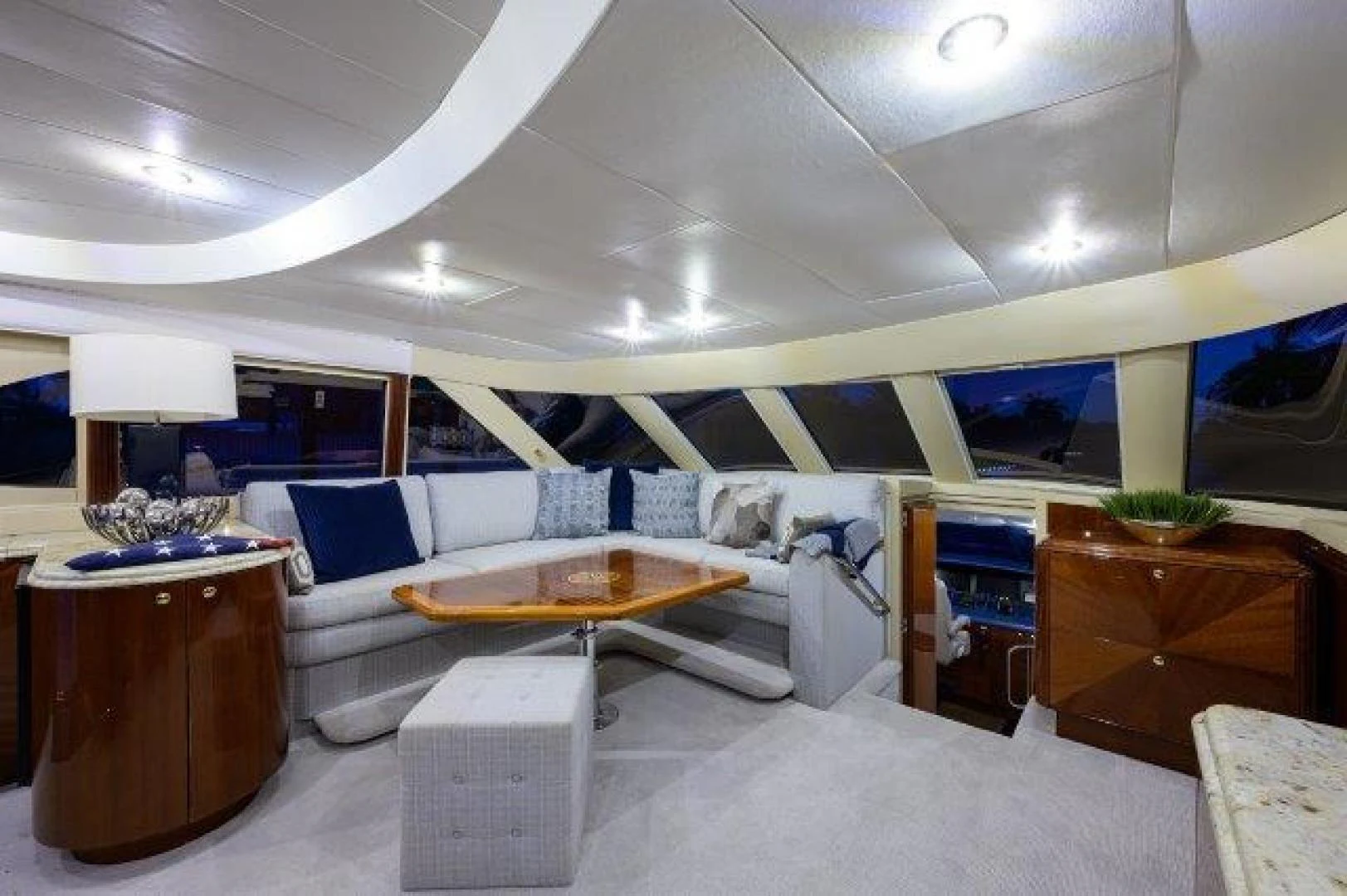a room with a couch and a table aboard TRYST Yacht for Sale