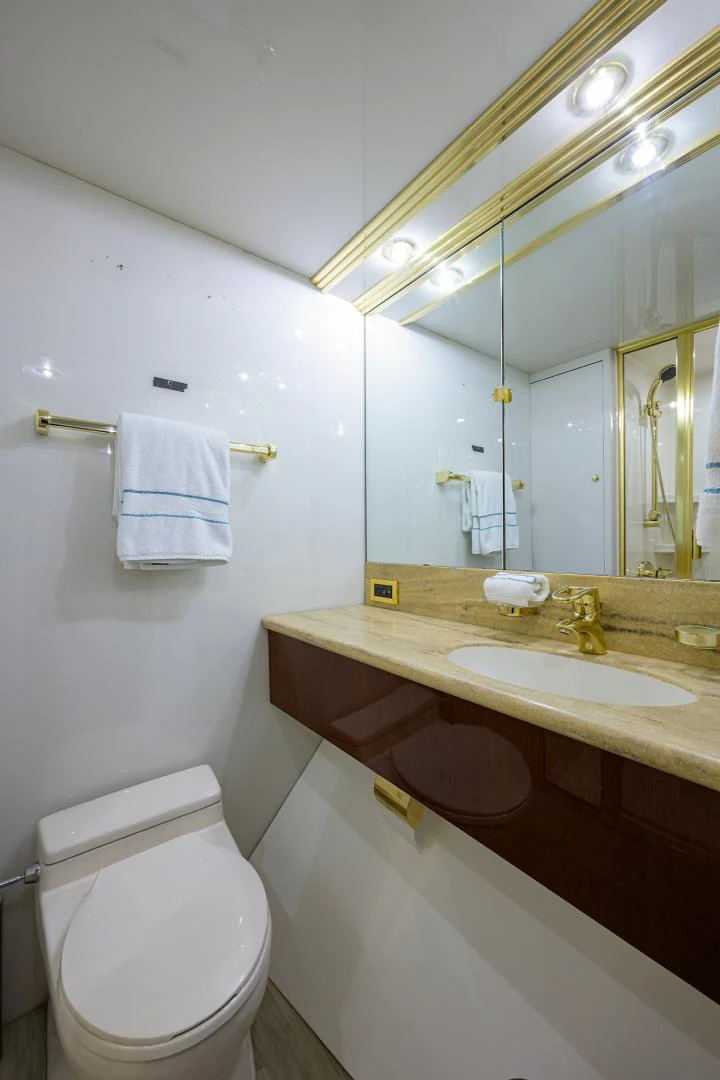 a bathroom with a sink and a toilet aboard TRYST Yacht for Sale
