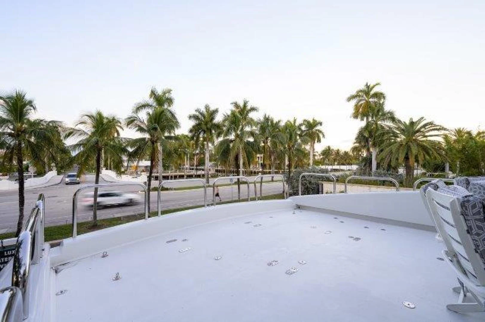 a pool with palm trees aboard TRYST Yacht for Sale