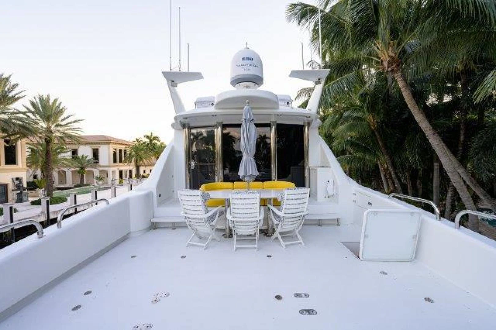a white tent with chairs and tables outside aboard TRYST Yacht for Sale