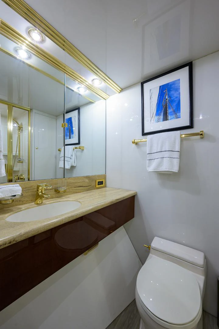 a bathroom with a sink and a mirror aboard TRYST Yacht for Sale