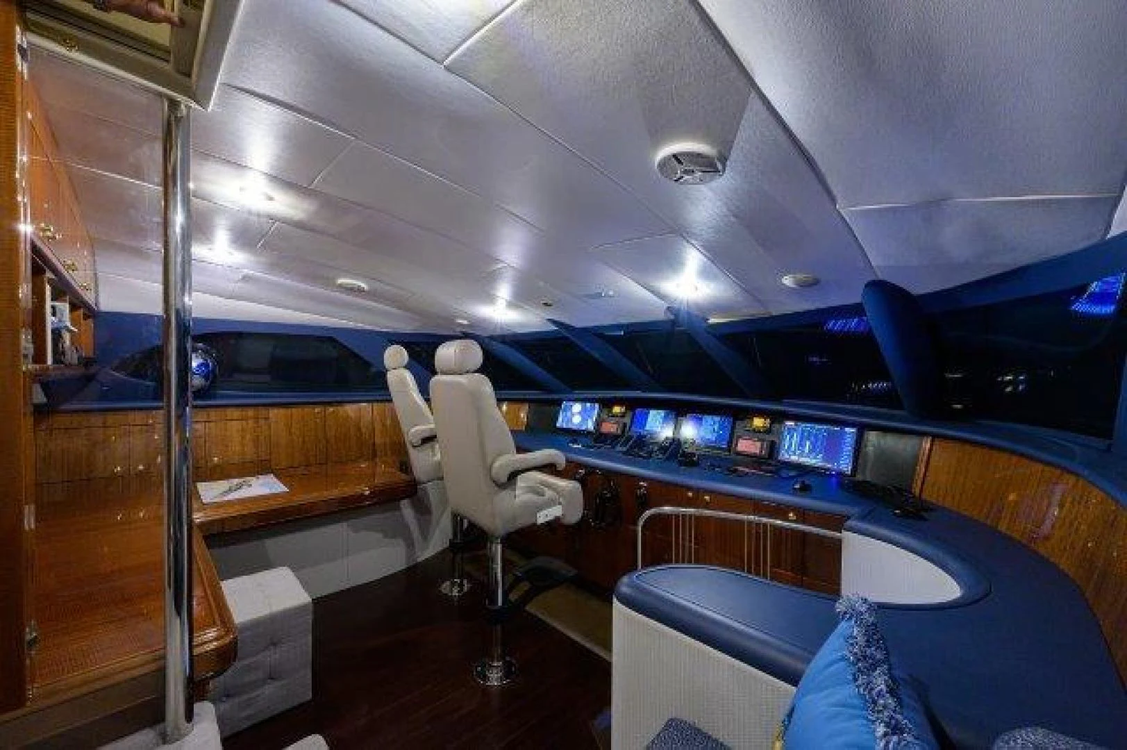 a room with a chair and a table with a chair aboard TRYST Yacht for Sale